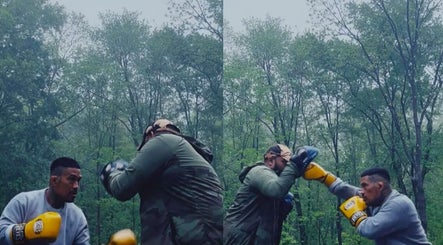 Outdoor boxing session at The Flow State Method LLC, Branchburg, New Jersey, US amidst lush green trees.