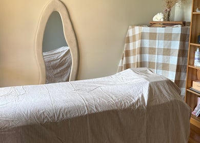 Cozy treatment room at Refined Beauty by Kate in Worrigee, New South Wales, AU featuring plush decor.