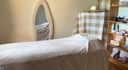 Cozy treatment room at Refined Beauty by Kate in Worrigee, New South Wales, AU featuring plush decor.