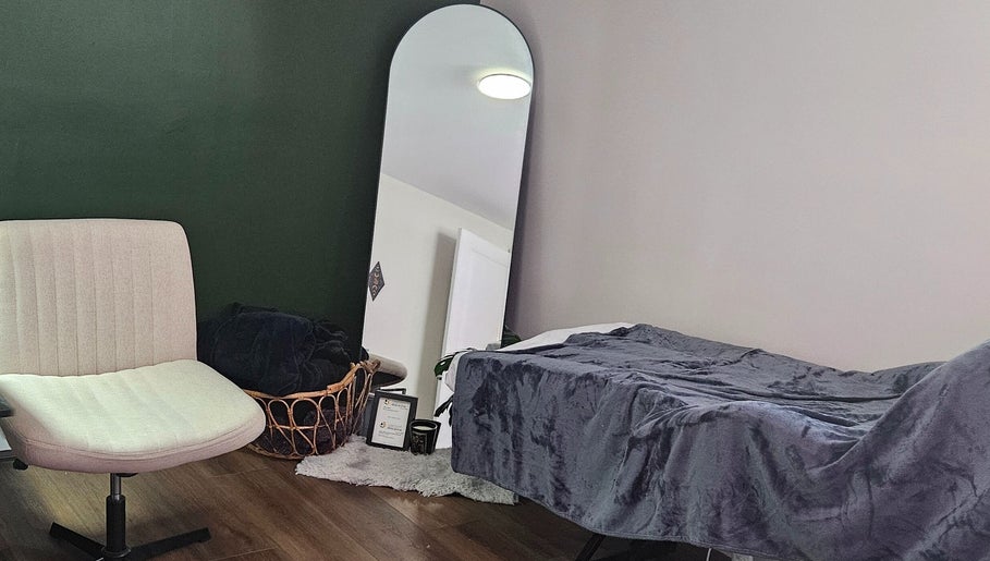 Cozy therapy room at Tranquil Beauty Lounge (Elmsdale), featuring a plush chair and mirror. Elmsdale, Nova Scotia, CA.