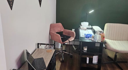 Cozy beauty treatment area at Tranquil Beauty Lounge (Elmsdale), featuring chairs and a well-equipped table.