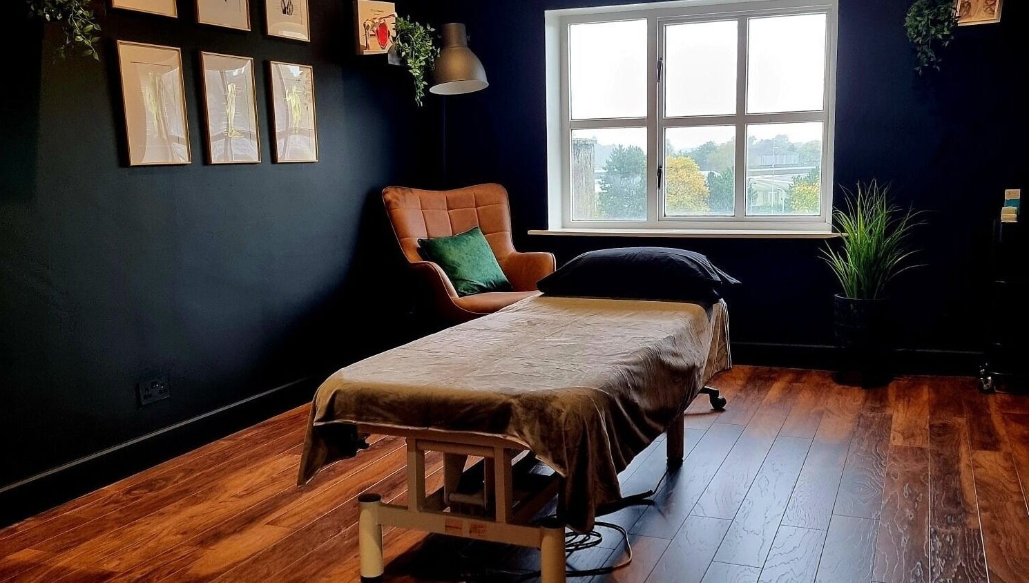Cozy massage room at Recovery Room Portadown, Portadown, Northern Ireland, GB with a window view.