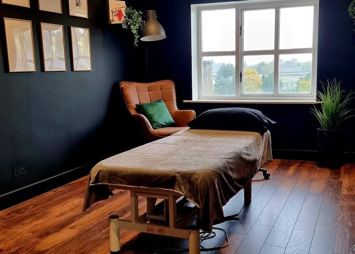 Cozy massage room at Recovery Room Portadown, Portadown, Northern Ireland, GB with a window view.