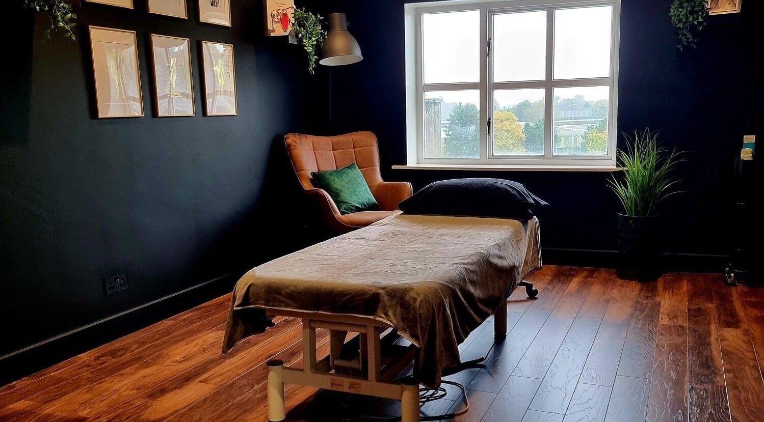 Cozy massage room at Recovery Room Portadown, Portadown, Northern Ireland, GB with a window view.