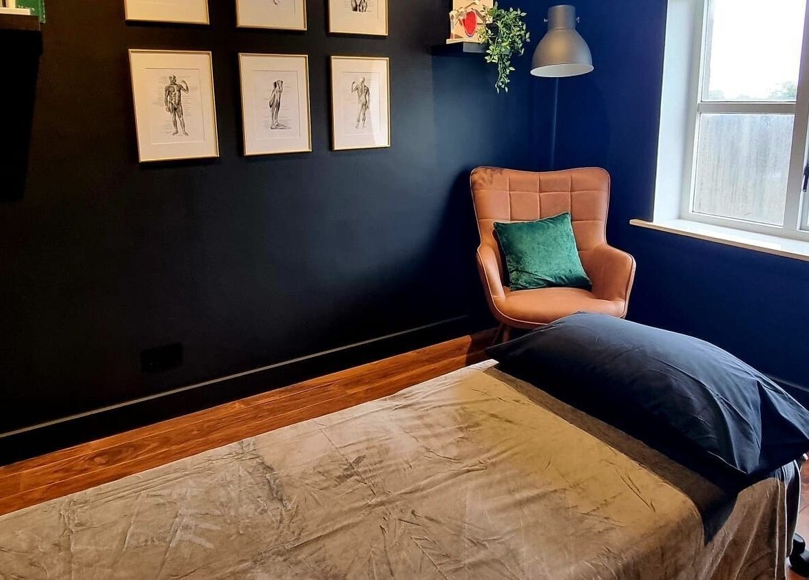 Calming massage room at Recovery Room Portadown, Portadown, Northern Ireland, GB with plush chair and decor.