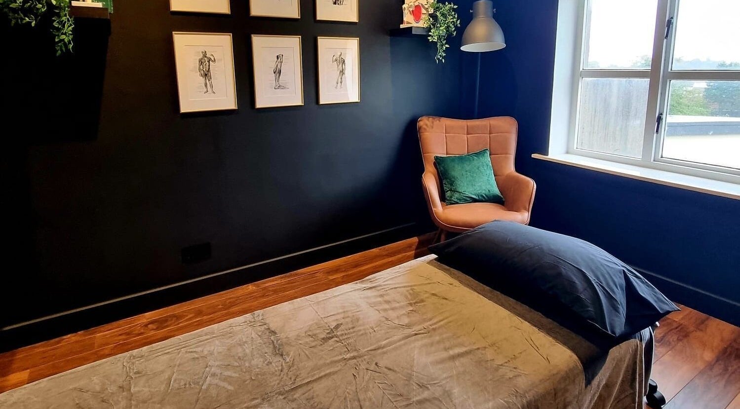 Calming massage room at Recovery Room Portadown, Portadown, Northern Ireland, GB with plush chair and decor.