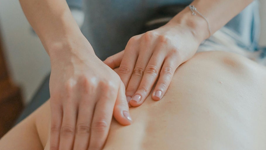 Therapist performing massage at Westland Massage in Denver, Colorado, US, focusing on relaxation and wellness.