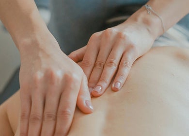 Therapist performing massage at Westland Massage in Denver, Colorado, US, focusing on relaxation and wellness.