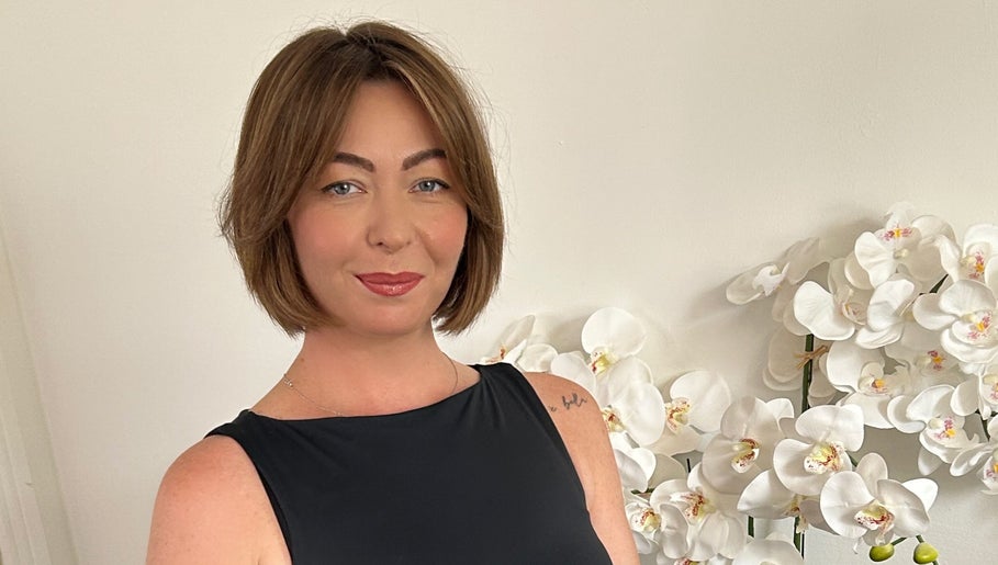 Hairstylist Diana Borisenkova at Carrick-on-Shannon, County Leitrim, IE with a chic bob haircut and white orchids.