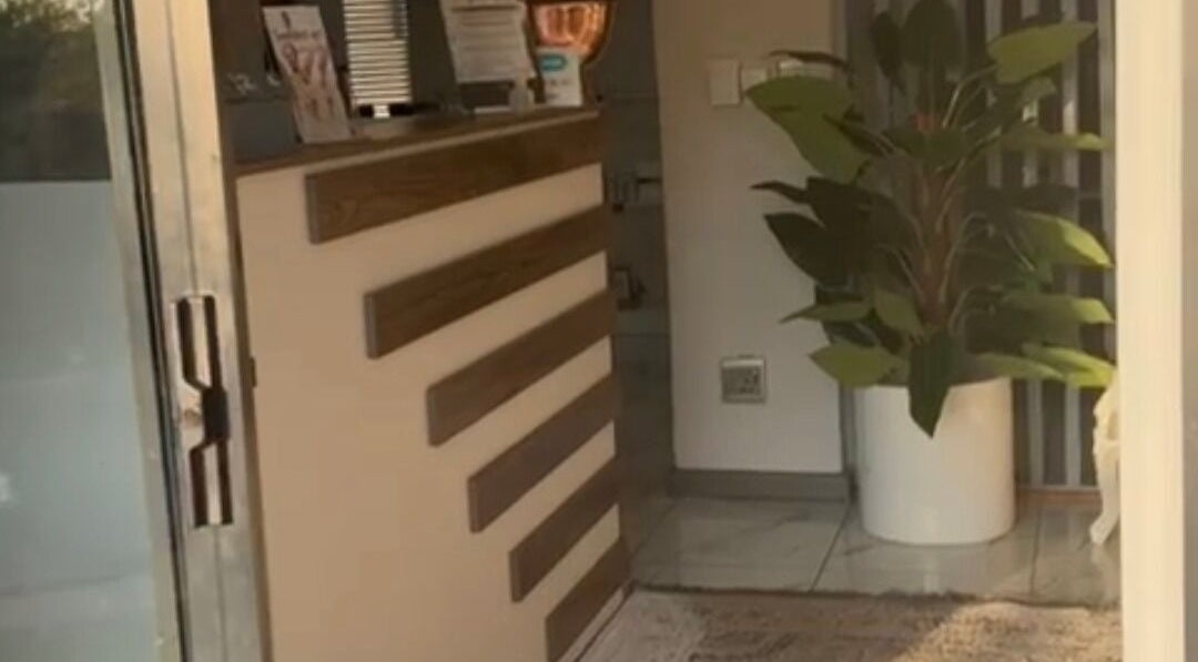 Chic entrance to Lashes by Latoya, Midrand, Gauteng, ZA, featuring stylish decor and indoor plant.