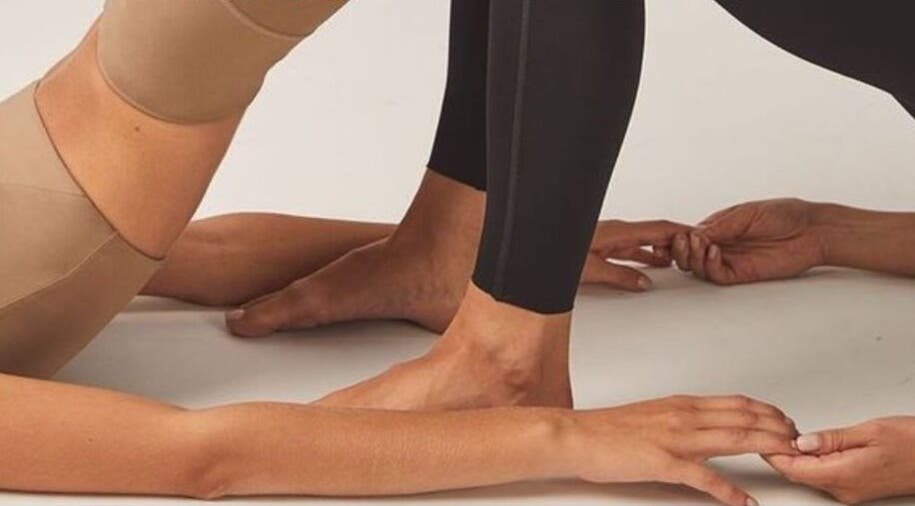 Yoga enthusiasts at Fierce Form Movement Lab in Mokopane, Limpopo, ZA practicing poses together.