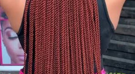 Elegant braided hairstyle at FAVOR HAIR STYLIST, Cape Town, Western Cape, ZA, showcasing intricate design.