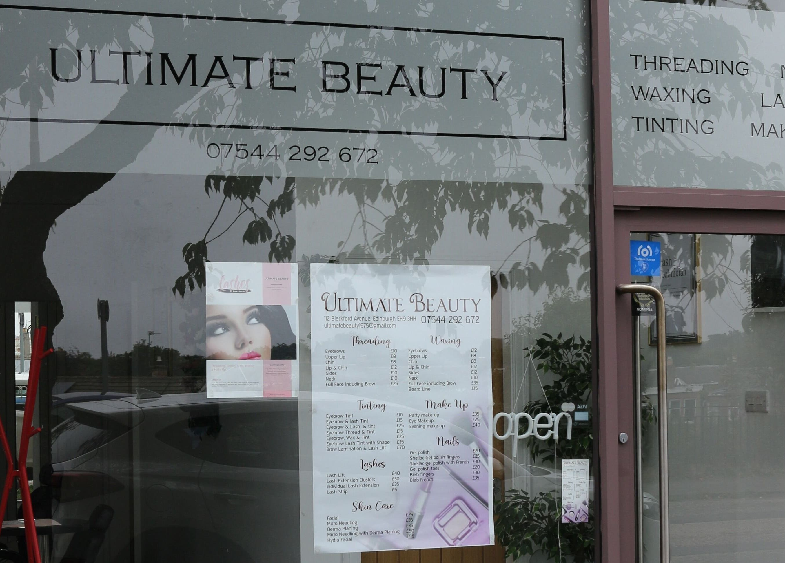 Front view of Ultimate Beauty salon in Edinburgh, Scotland, GB, showcasing services and contact details.