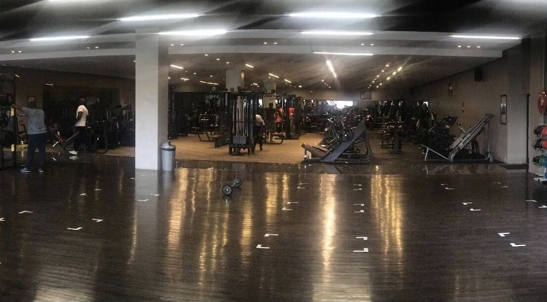 Spacious gym area at Gym Buddy SA in randburg, ZA with modern equipment and workout stations.