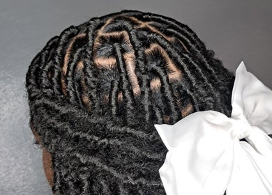 Intricate braid with white bow at jay_.beauty_esthetics, Point Fortin, Point Fortin Borough Corporation, TT.