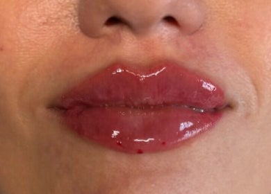 Glossy, enhanced lips at Faces by MR - Garforth, located in Garforth, England, GB, highlighting beauty services.