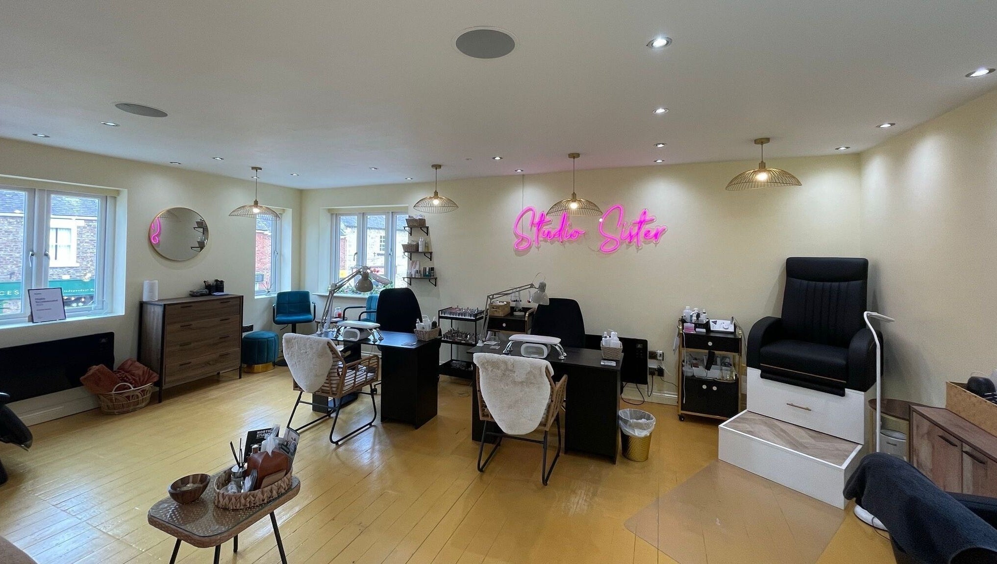 Faces by MR - Wetherby, an inviting salon space in Wetherby, England, GB, featuring modern decor and styling stations.