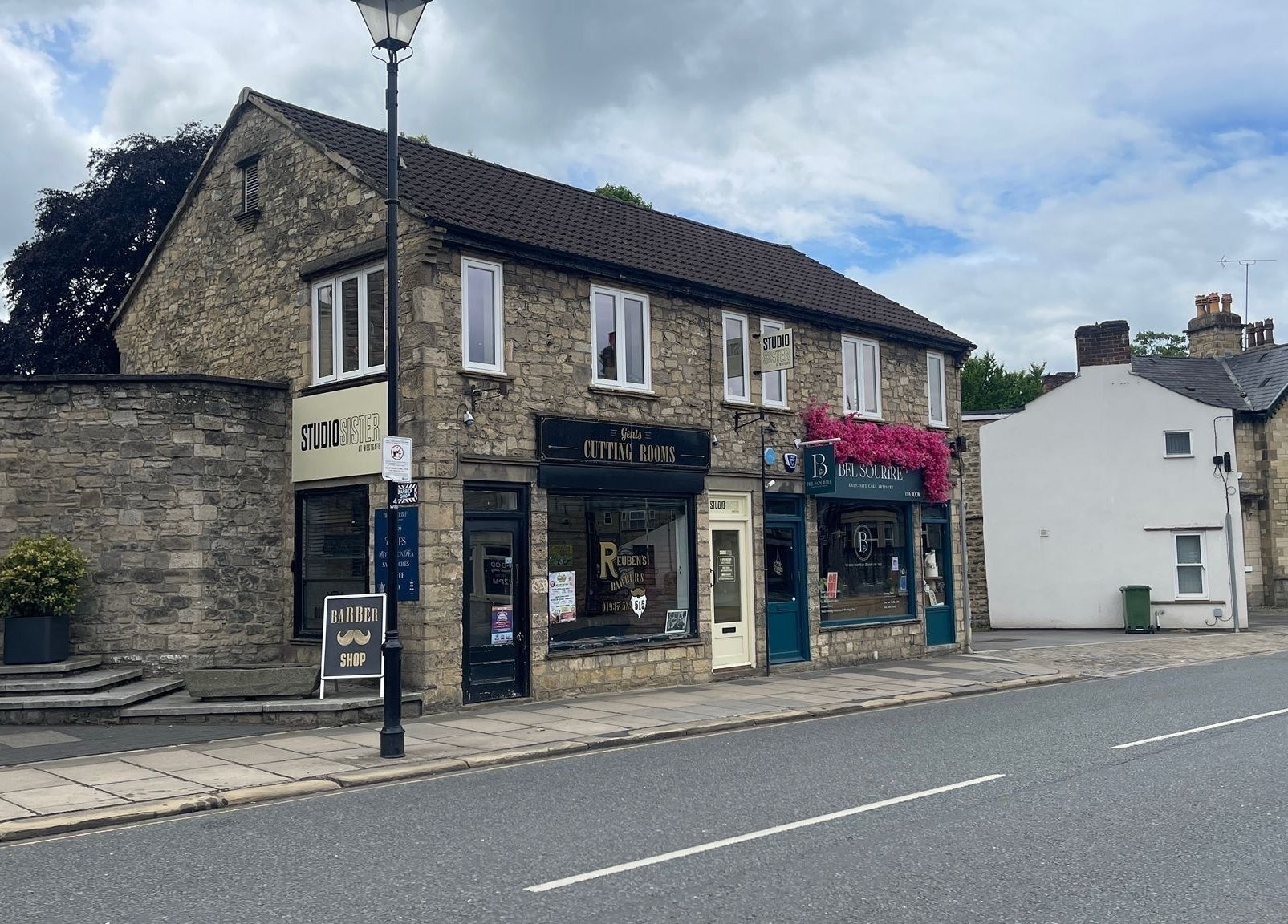 Faces by MR - Wetherby venue on a quaint street in Wetherby, England, GB with classic stone architecture.