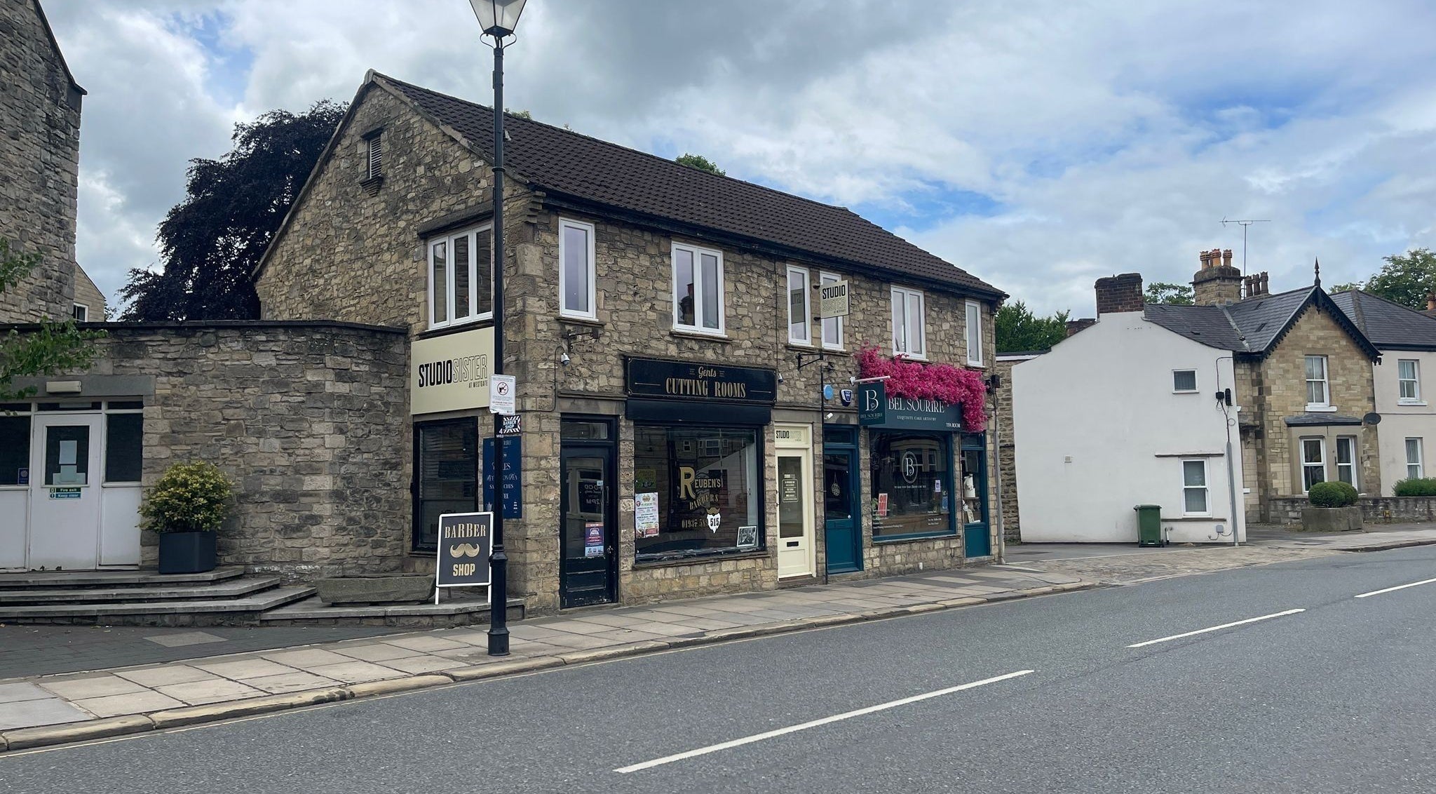 Faces by MR - Wetherby venue on a quaint street in Wetherby, England, GB with classic stone architecture.