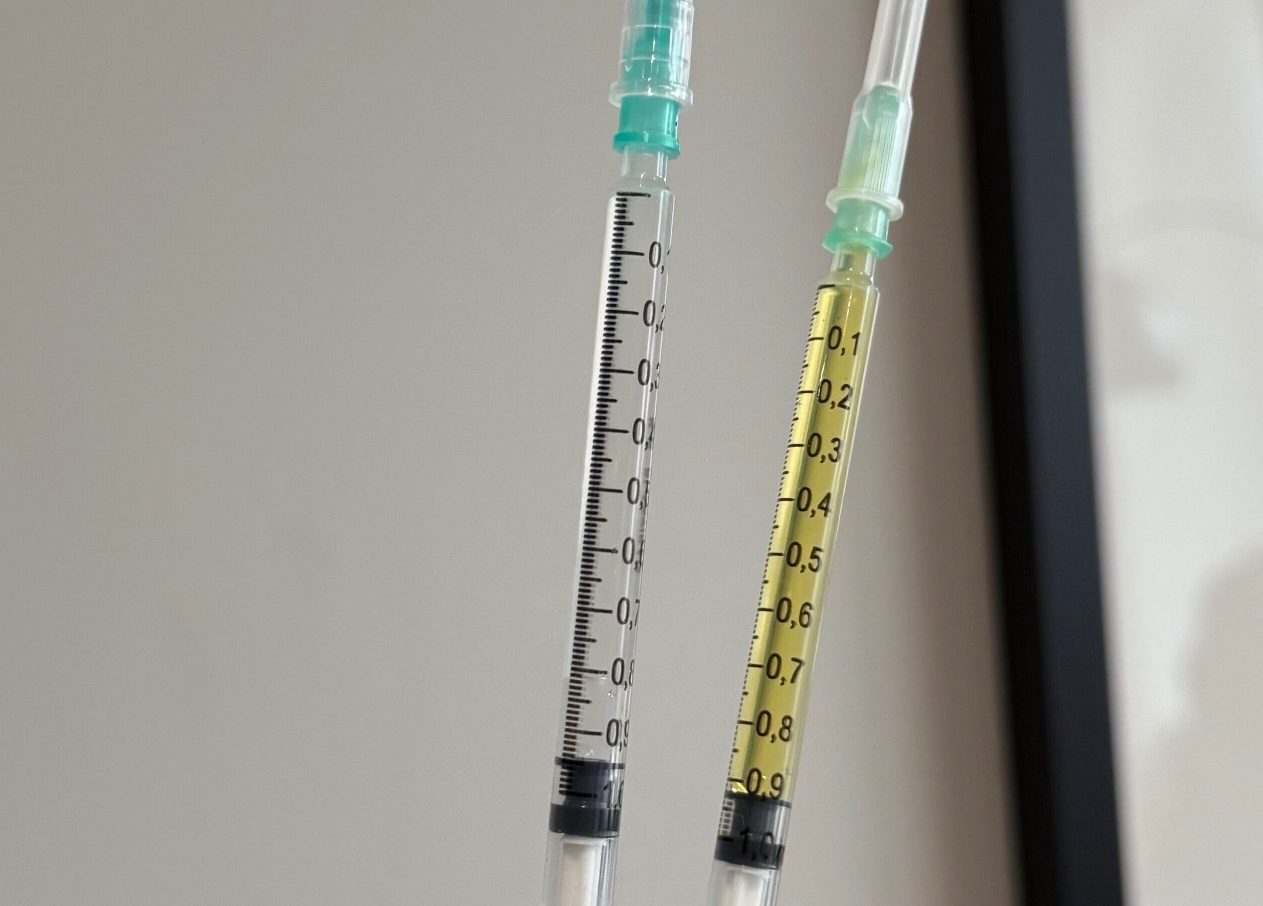 Close-up of syringes at Re.scalp, Birmingham, England, GB showcasing wellness procedures.