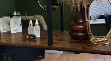Chic nail station at Olya Fine Nails, Manchester, England, GB with essential oils and decorative mirror.