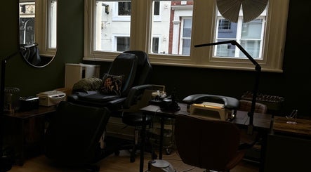 Comfortable nail service setup at Olya Fine Nails, Manchester, England, GB. Modern interior with plush chairs.