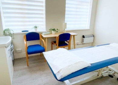 Peaceful therapy room at Gosia Massage Therapy Clapham, London, England, GB. Features massage table and cozy seating.