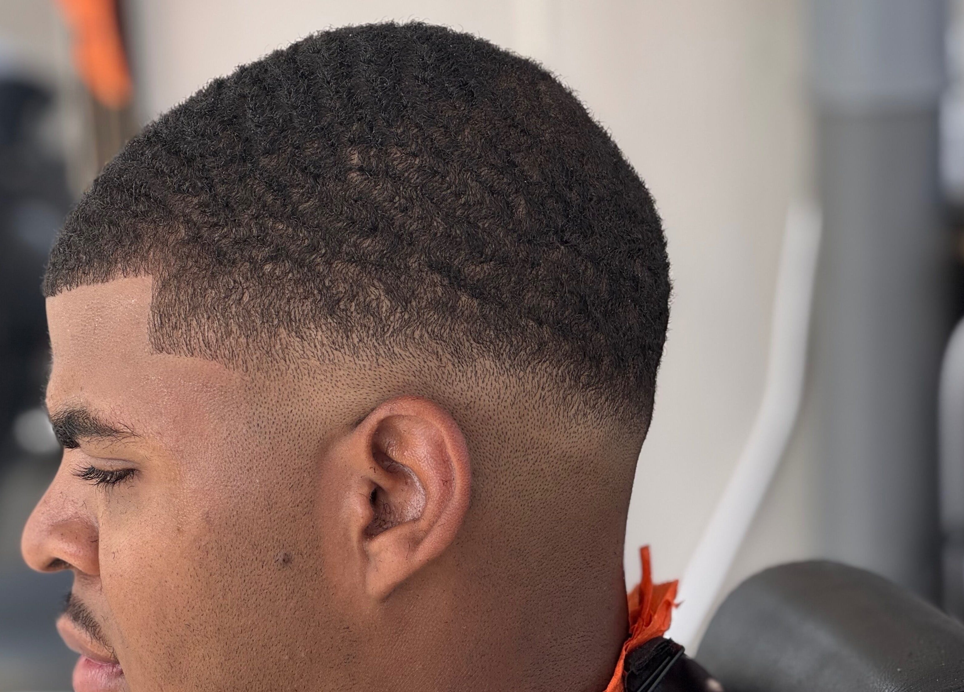 Clean fade haircut at Youngnino, Willemstad, Curaçao, CW. Highlighting expert barber skills.