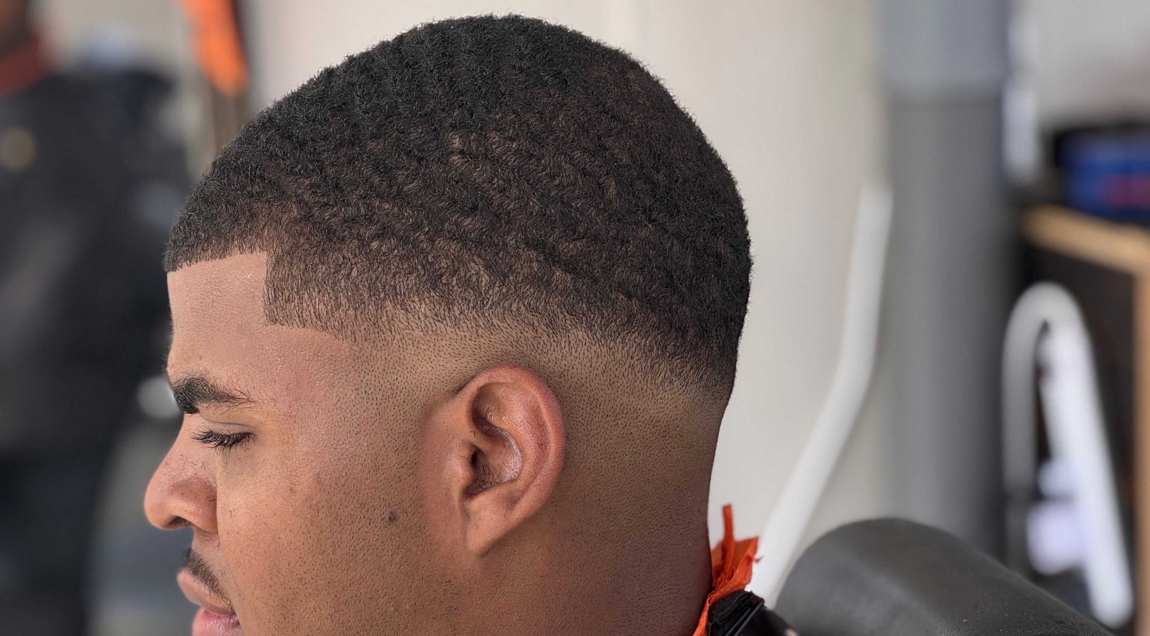 Clean fade haircut at Youngnino, Willemstad, Curaçao, CW. Highlighting expert barber skills.