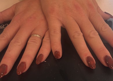 Elegant manicure with rich red polish at Luxe by Annabelle in Knutsford, England, GB.