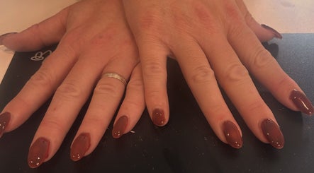 Elegant manicure with rich red polish at Luxe by Annabelle in Knutsford, England, GB.