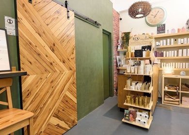 Interior of That Organic Salon in Sydney, New South Wales, AU showcasing natural wood and eco-products.