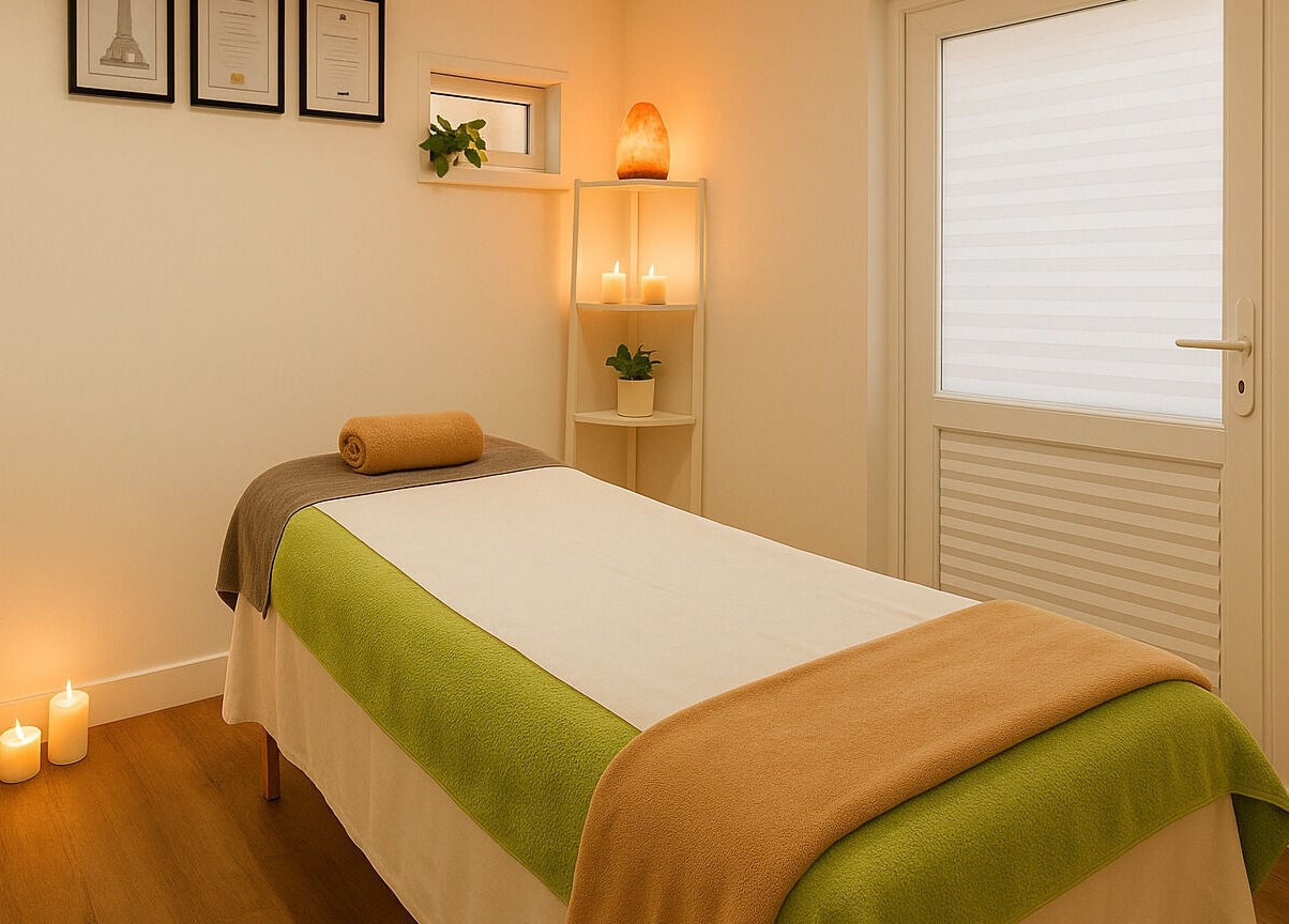 Relaxing therapy room at Holistic Massage by Kay, Eaglestone, England, GB. Cozy ambiance with candles and plants.