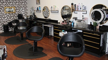Modern salon at Wax & Hair Boudoir, Irmo, South Carolina, US, featuring stylish chairs and mirrors.