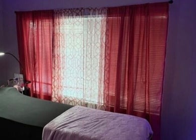 Luxelashes.Dy spa room with a treatment bed and ambient lighting in Las Vegas, Nevada, US.