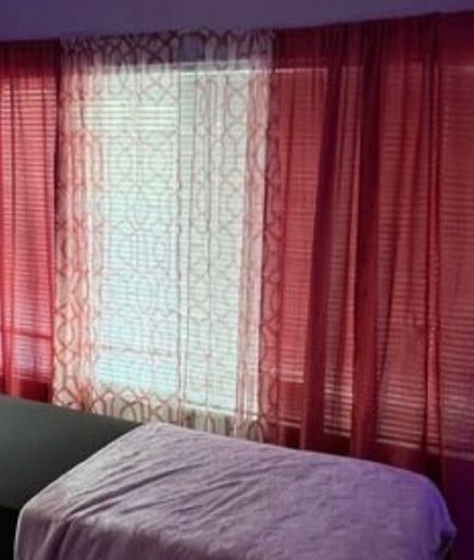 Luxelashes.Dy spa room with a treatment bed and ambient lighting in Las Vegas, Nevada, US.