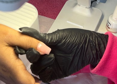 Manicure at NailswithAmy, Western Cape, ZA. A hand is pampered with detailed nail art.