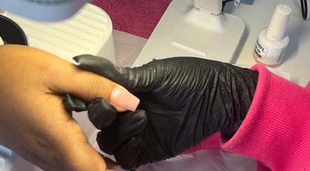 Manicure at NailswithAmy, Western Cape, ZA. A hand is pampered with detailed nail art.