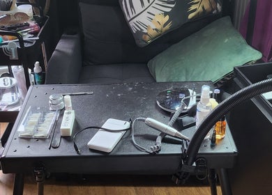 Nail station at Danni's Den: Beauty Refined, Wellingborough, England, GB, showcasing essential tools and products.