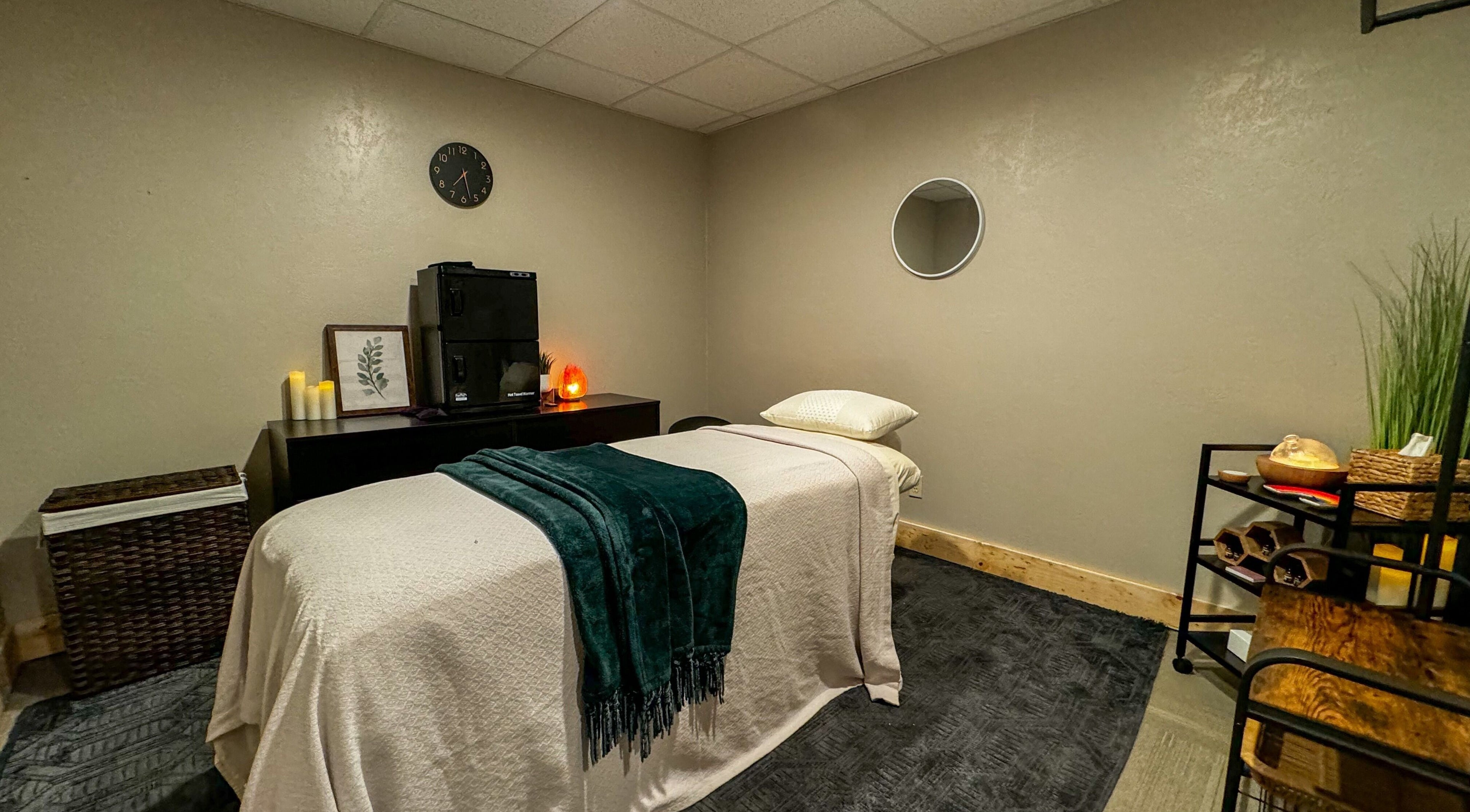 Cozy massage room at Sol Rise Massage, North Salt Lake, Utah, US, featuring a massage table and calming decor.