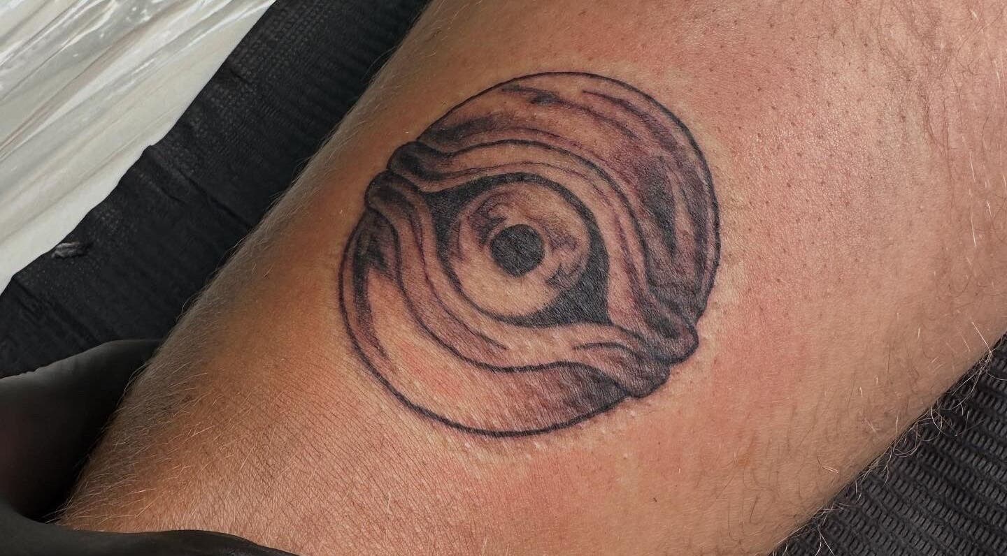 Unique circular tattoo at Taisia's Ink Lab in Watford, England, GB showcasing intricate detailed art.