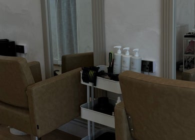 Modern salon chairs and products at Monetlillyhair, Clifton, England, GB, showcasing a chic beauty environment.