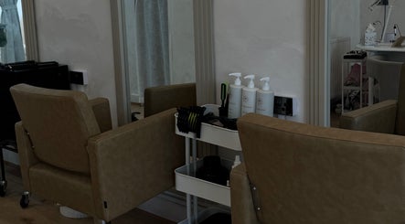 Modern salon chairs and products at Monetlillyhair, Clifton, England, GB, showcasing a chic beauty environment.