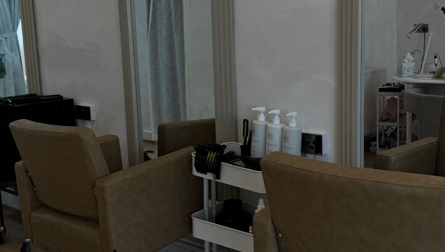 Stylish hair styling station at Monetlillyhair, Clifton, England, GB, showcasing salon chairs and products.
