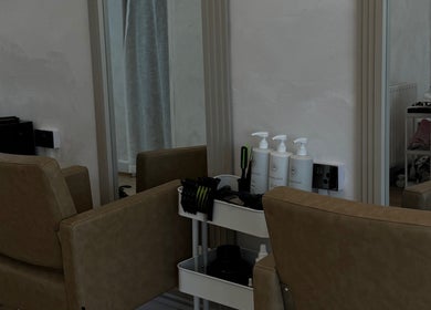 Stylish hair styling station at Monetlillyhair, Clifton, England, GB, showcasing salon chairs and products.