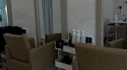 Stylish hair styling station at Monetlillyhair, Clifton, England, GB, showcasing salon chairs and products.