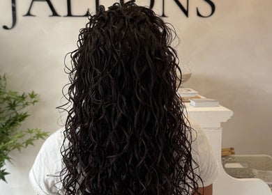 Back view of long curly hair at Monetlillyhair, Clifton, England, GB salon.
