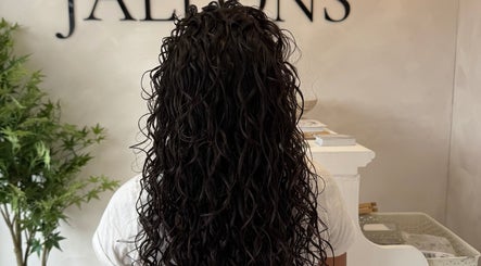 Back view of long curly hair at Monetlillyhair, Clifton, England, GB salon.