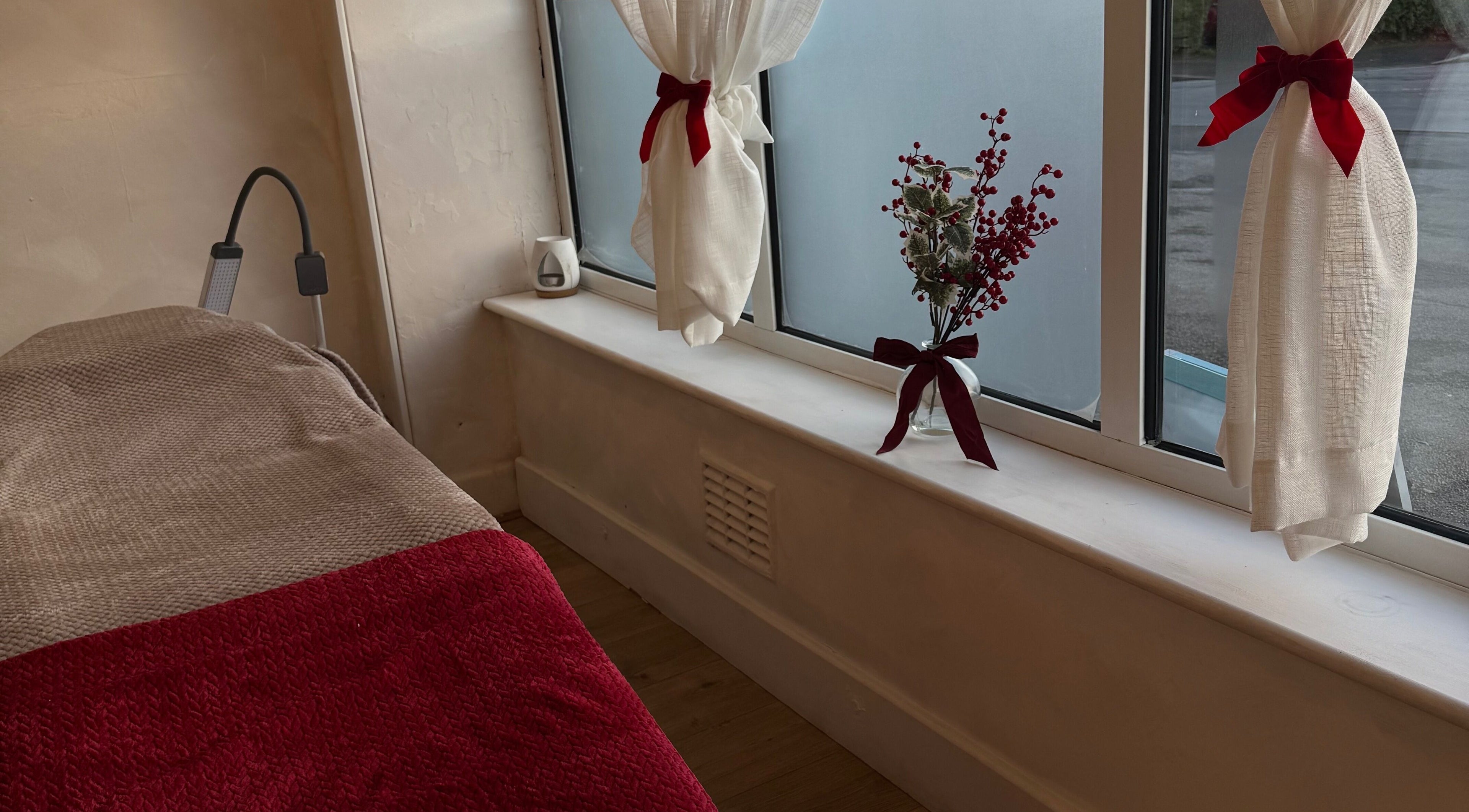 Tranquil treatment room at Monetlillyhair, Clifton, England, GB with cozy decor and natural light.