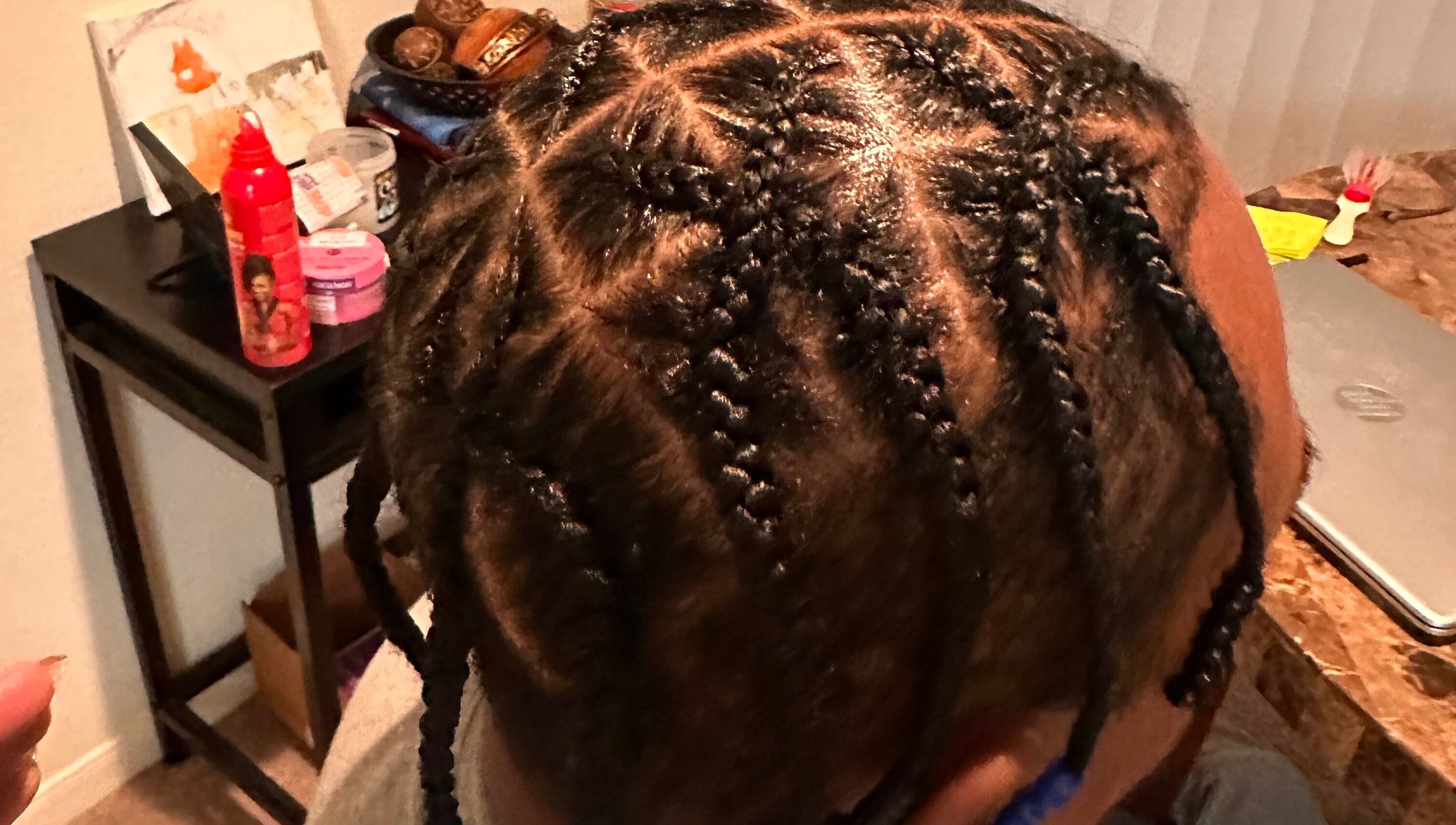Intricate braids styled at Natural Braids By Val in Indianapolis, Indiana, US.